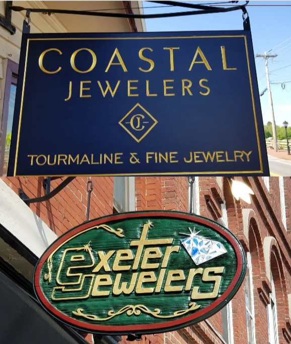 Restoration and renovation work on a carved wooden sign