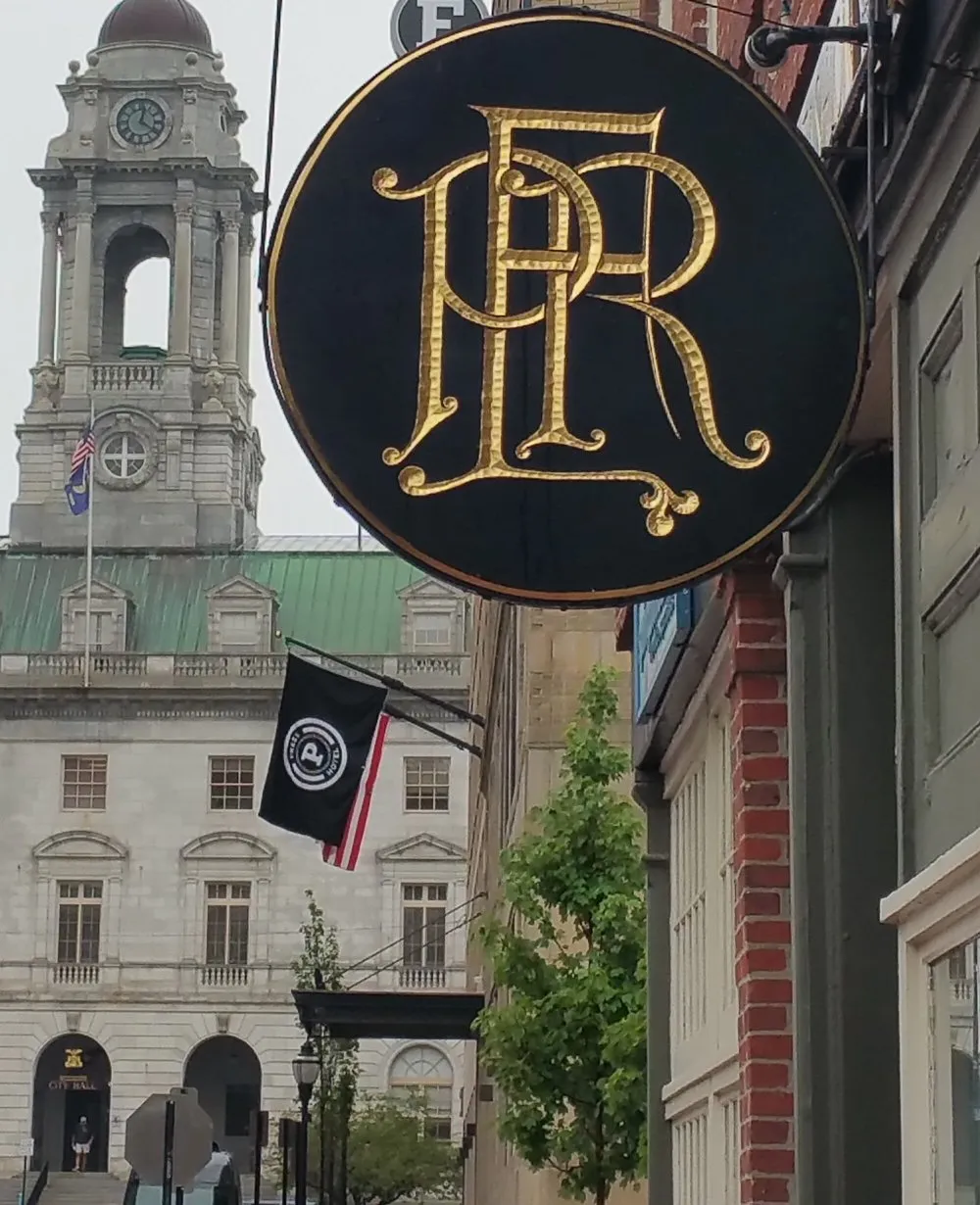 Custom business sign with gold-leaf lettering